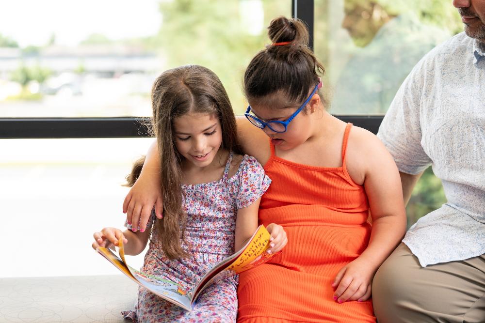 Girl with special needs reading with another girl, palos heights il